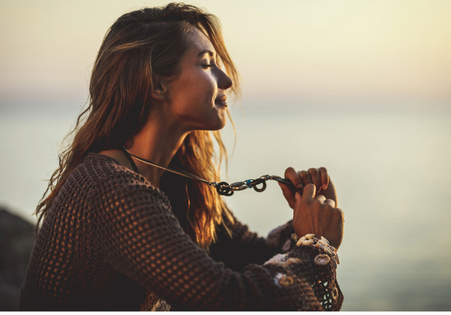 Woman holding a chain with a blurred background